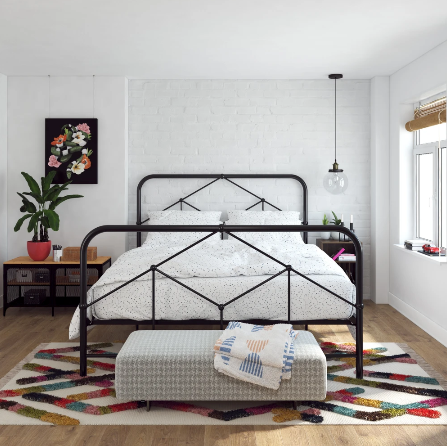 the black metal bed in a room