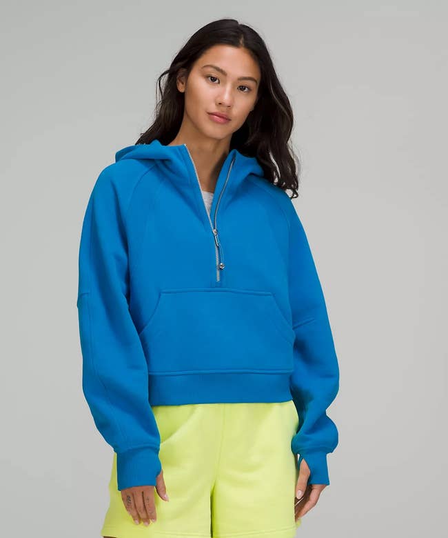 model wearing the hoodie in bright blue