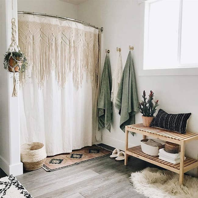 A macrame curtain hanging on a shower