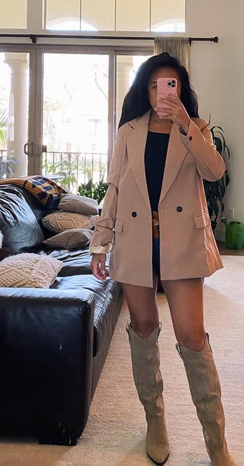 a reviewer wearing the blazer in tan 