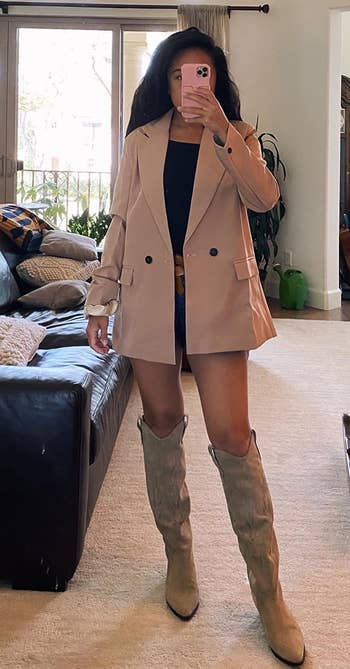 a reviewer wearing the blazer in tan 