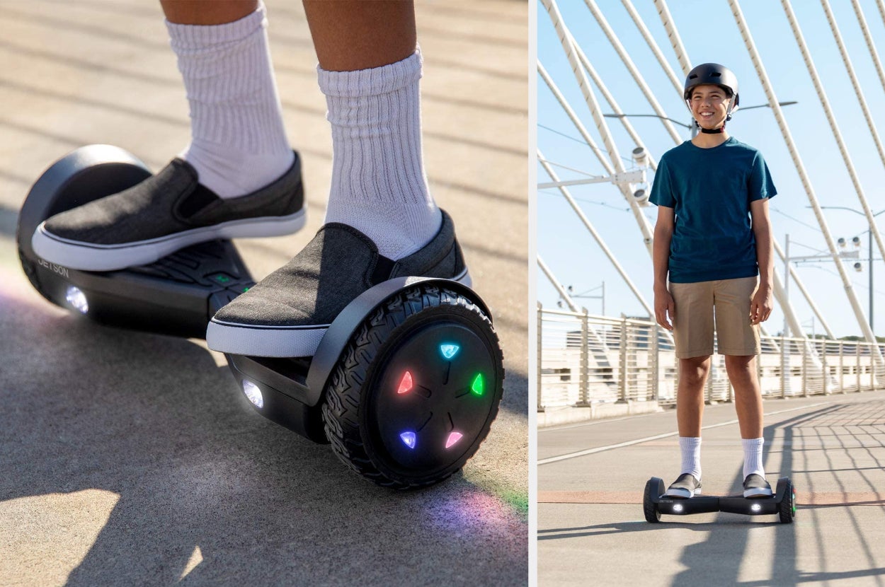 Close up of model standing on black hoverboard with multi-colored lights on wheels, model on product with helmet on