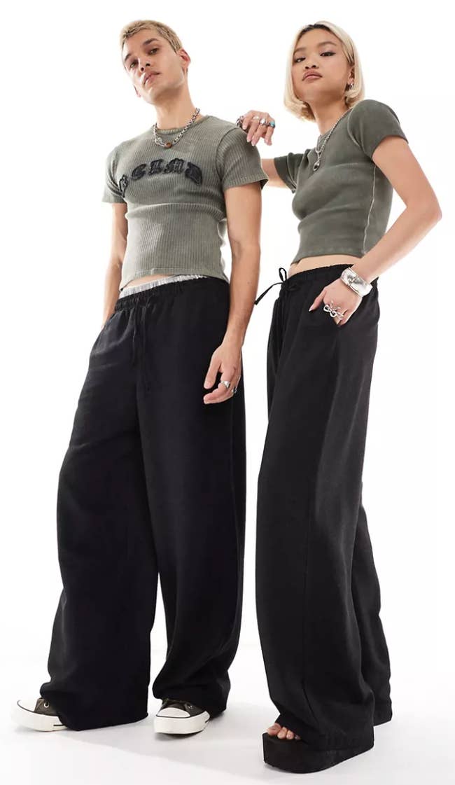 Two models in oversized black pants