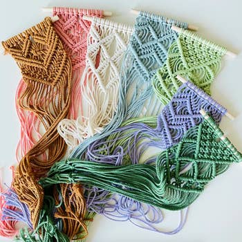 Image of several different colored macrame hangers