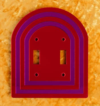 a red and purple double-switch cover 