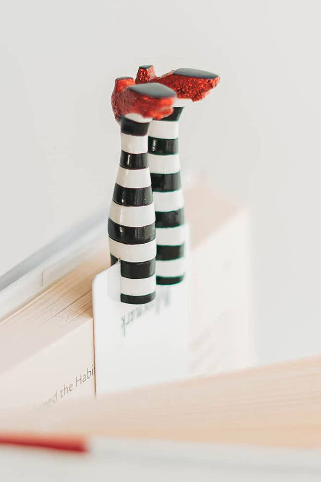 bookmark with three dimensional feet with sparkling red slippers and striped tights