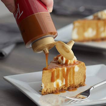 pumpkin sauce being drizzled onto cake