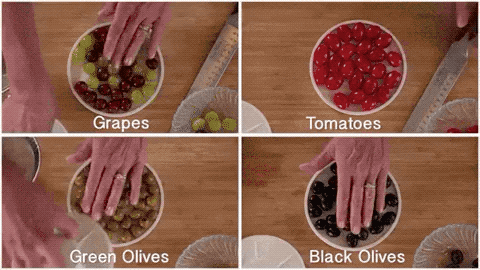gif of person using cutter to cut olives, grapes, and tomatoes in half in one cut
