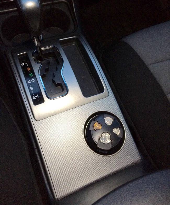 reviewer photo of the coin organizer in their car's cup holder