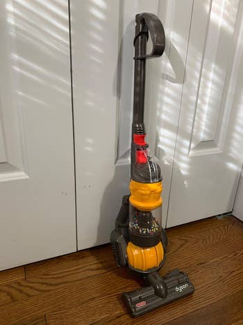 reviewer representation  of the mini Dyson vacuum