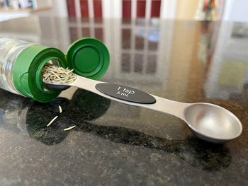 A reviewer's measuring spoon easily fit into a spice jar