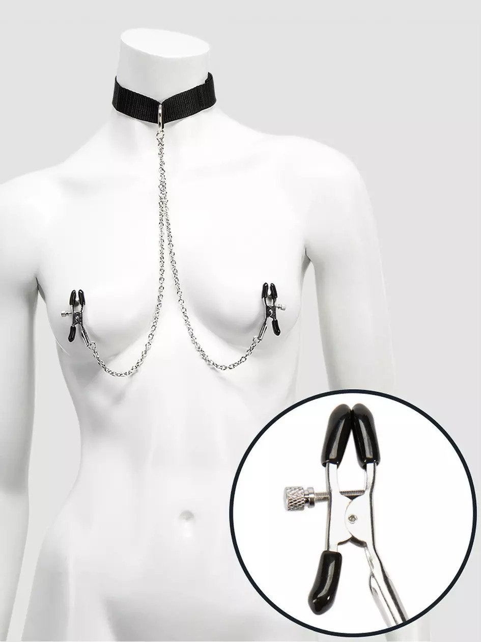 Mannequin wearing black collar with attached nipple clamps