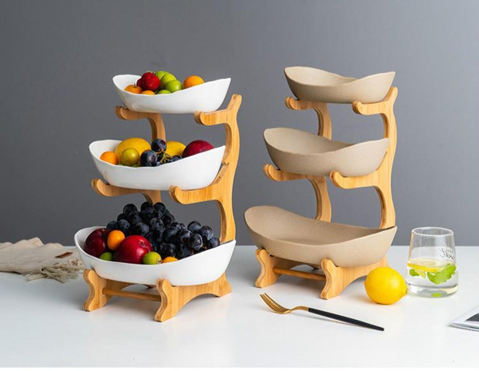 three tier holders of fruit bowls