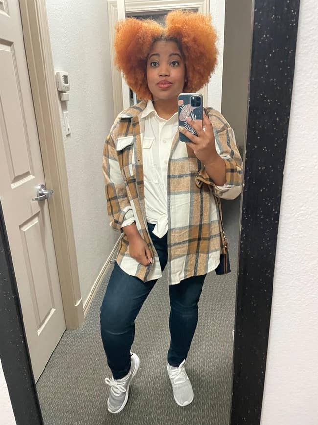 reviewer wearing apricot plaid shacket
