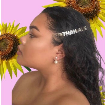 model wearing a name hair clip that says 