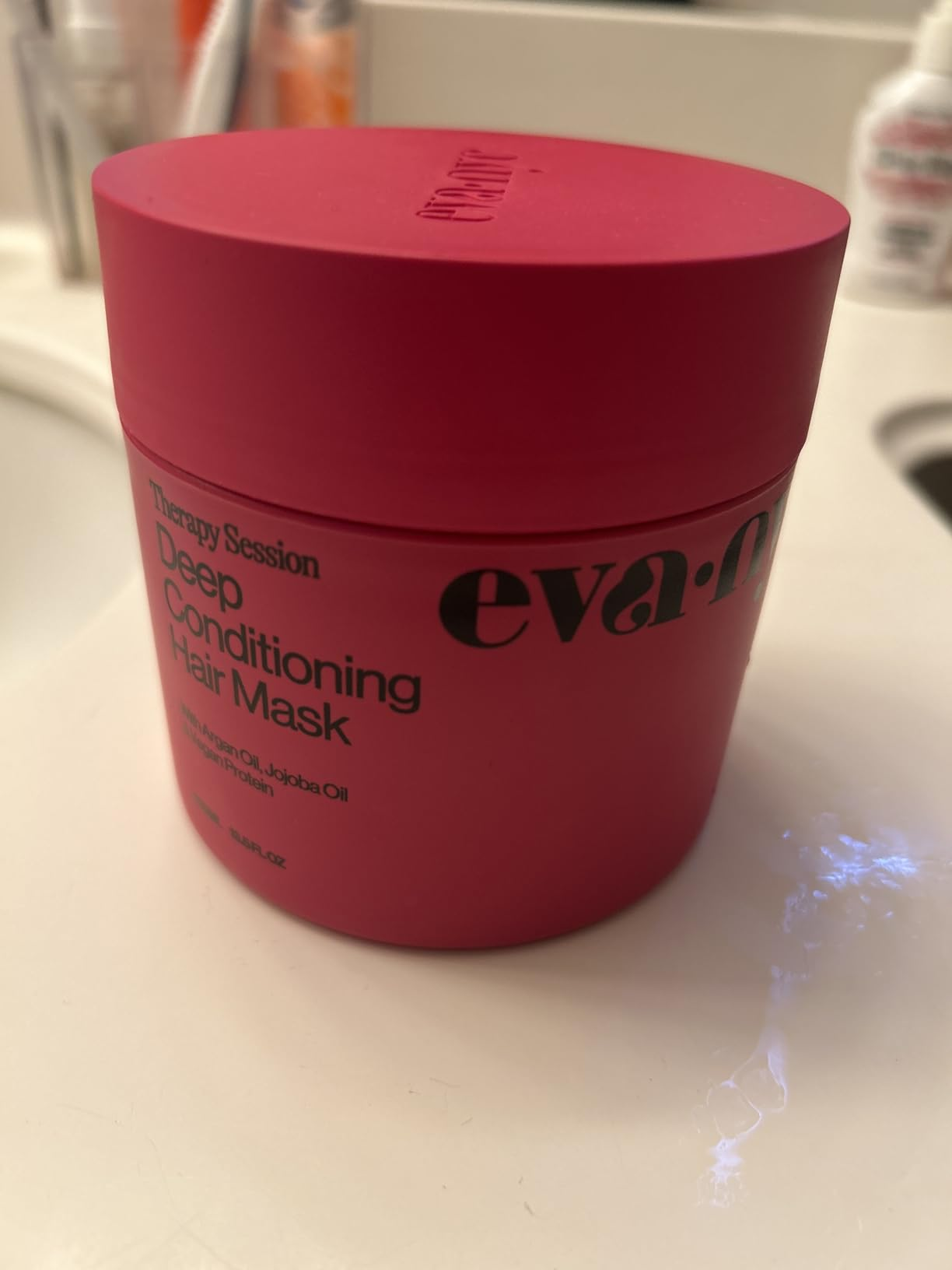 Eva NYC Deep Conditioning Hair Mask instrumentality  connected  a bath  counter