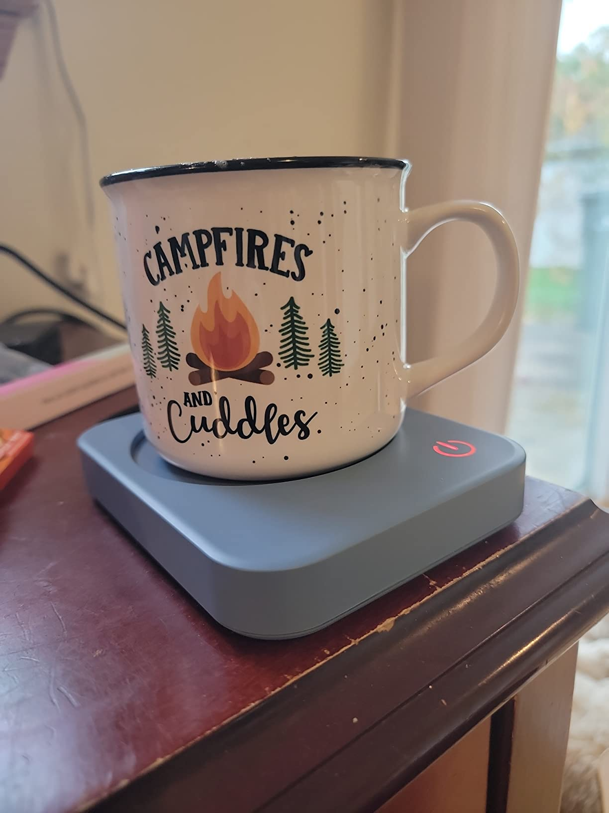 white mug connected  the woody  warmer