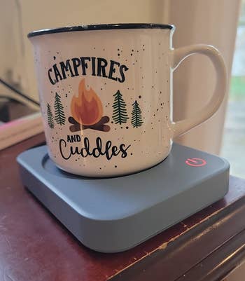 white mug connected the woody warmer