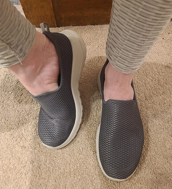 Reviewer wearing gray shoes