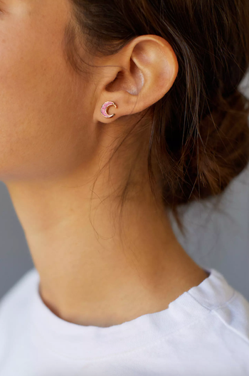 a model wearing the moon stud