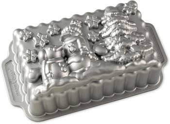 an aluminum nordic ware tray with a snowman scene on the bottom