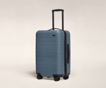 the light blue suitcase 