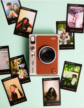 brown instant camera with photos around it