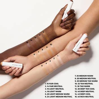 Various tegument code shades connected 2 arms, each swatched with instauration sticks labeled with numbers, showcasing a constitution brand's range