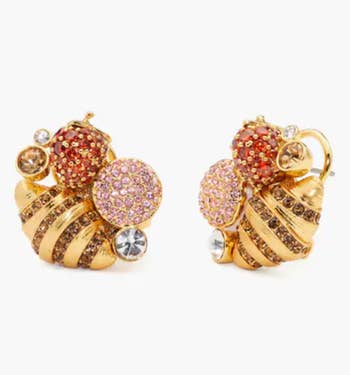 jeweled studs with a croissant, strawberry, and macaron