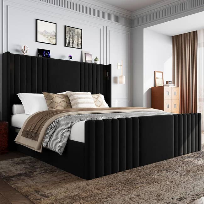 Modern chamber  with a ample  upholstered bed, patterned pillows, and a neutral rug, showcasing stylish and cozy interior decor for location  buying  inspiration