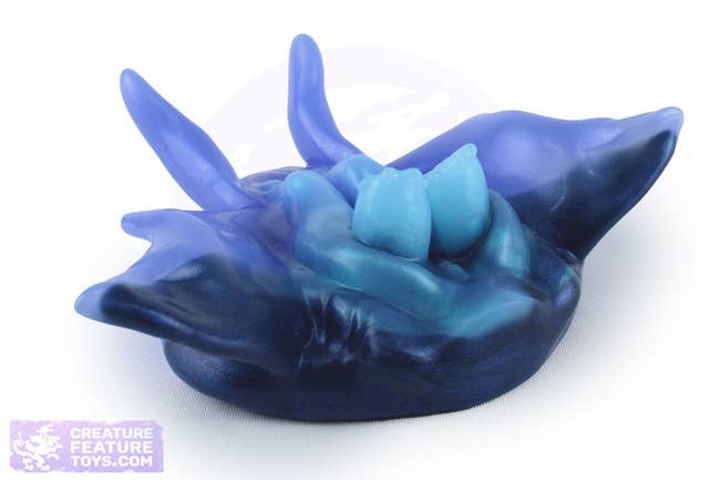 Decorative bluish  silicone bath brushwood  with a unique, abstract oversea  carnal   design, featured successful  a buying  context