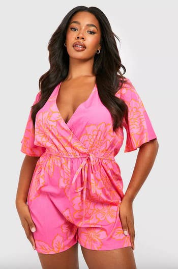 front view of model in pink romper
