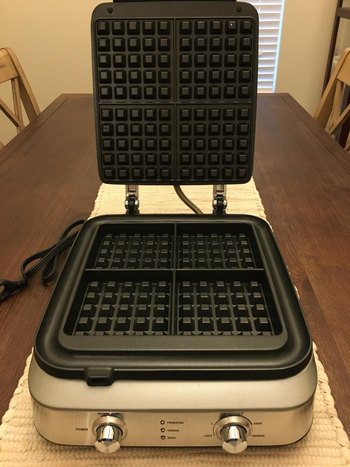 Reviewer image of the inside of the black and silver waffle maker