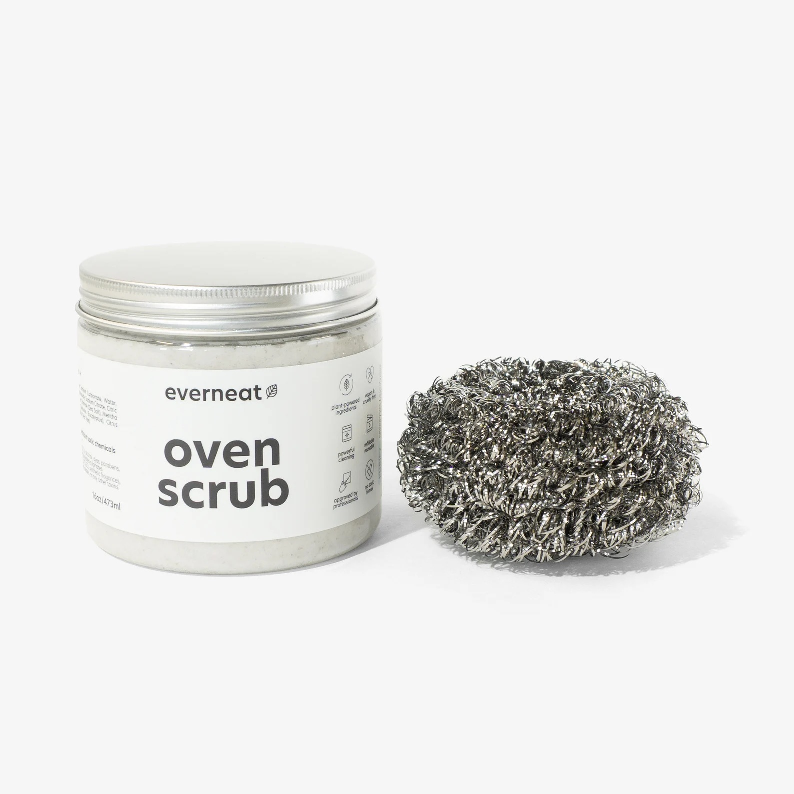 the jar of oven scrub next to a metallic scrubber