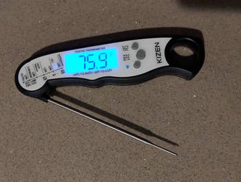 a meat thermometer with the display light on