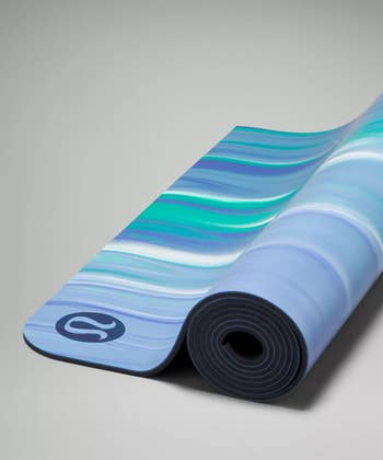 the blue and green colored yoga mat