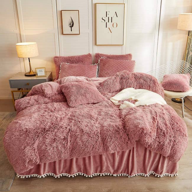 the old pink faux fur duvet set on a bed