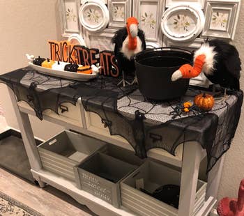 reviewer's hallway halloween table with curtains used as table runner 