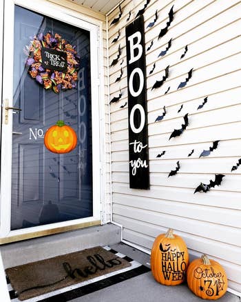 reviewer's front door area decorated with bats stuck on the wall