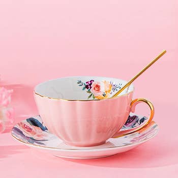 Elegant floral teacup and saucer with gold spoon