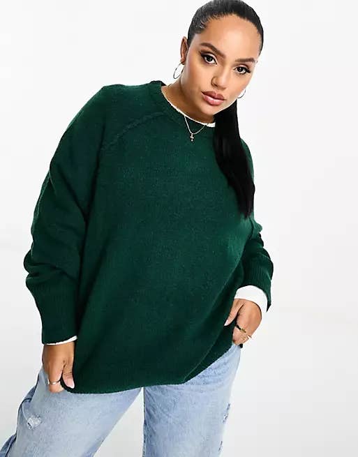 model wears green sweater