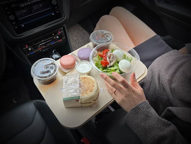 tray that fits into car cup holder with food on top 