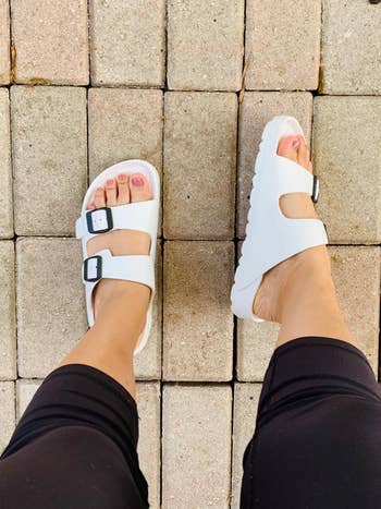 reviewer wearing the shoes successful white