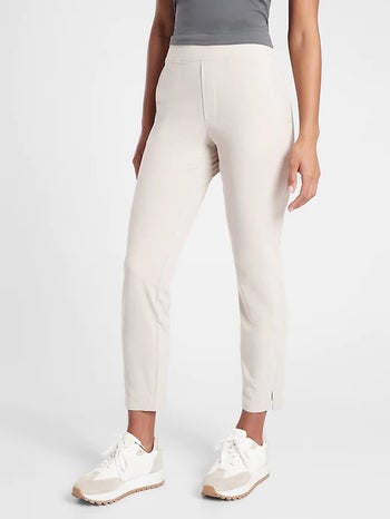 model wearing white ankle pants