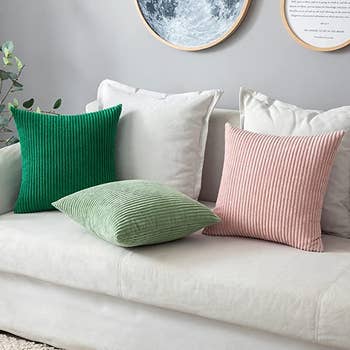 The pillowcases in dark green, light green, and light pink