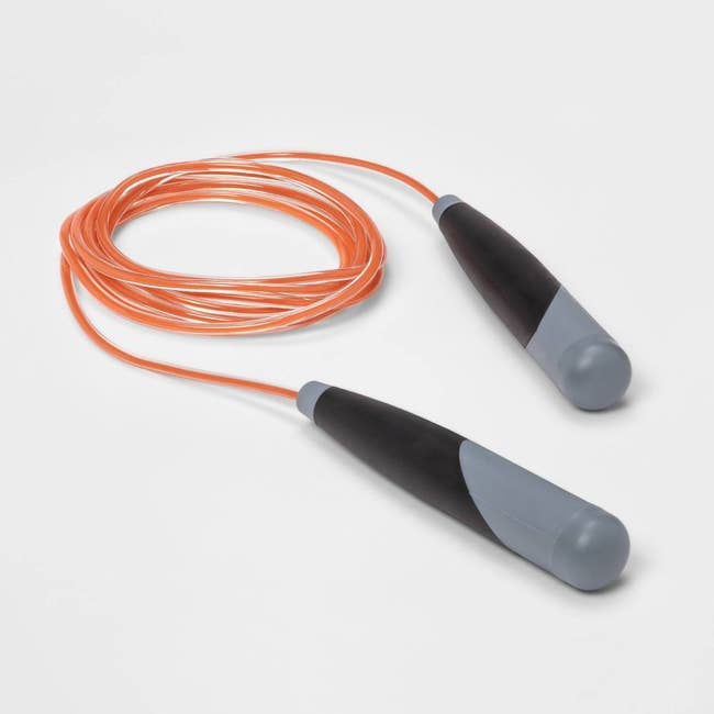 the weighted jumprope with black and gray handles and an orange rope