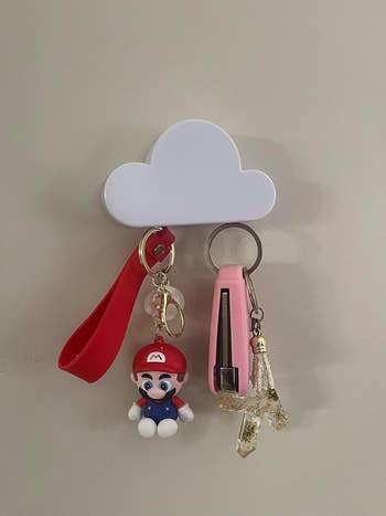 reviewers magnetic cloud shaped key holder attached to a wall holding a set of keys
