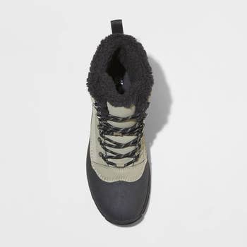 top view of a khaki and black snow boot with faux fur lining