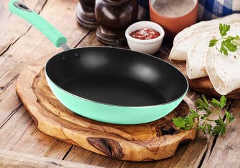 a mint green frying pan