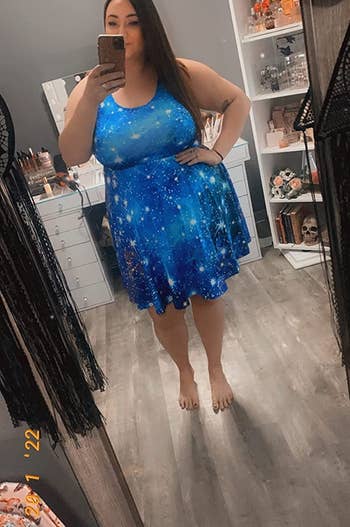 another plus size reviewer wearing the blue astronomy dress